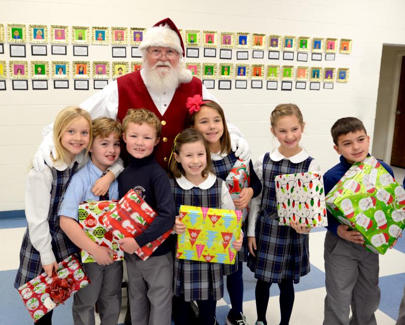 Pictured with Santa are second-graders with gifts for Diakonia. Shown are (l-r) Lily Barker, Elliott Mason, Liam McAllister, Kaylin Zervakos, Elle Wilsey, Caroline Burbage and Brax Giardina. SUBMITTED PHOTOS
